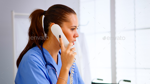 Specialist doctor nurse checking appointment during telehealth - Stock Photo - Images