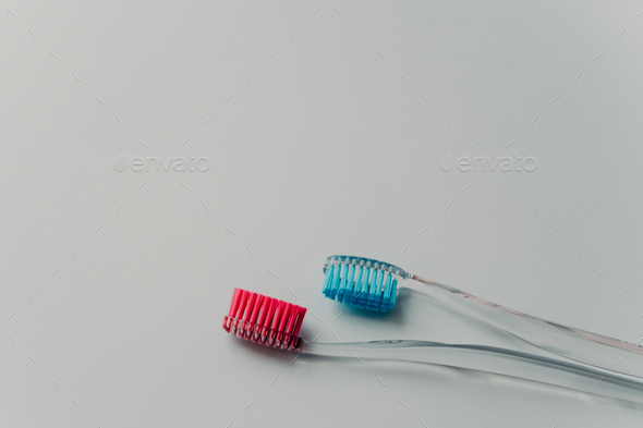 Cleaning teeth is correct way. Plastic toothbrushes for oral hygiene isolated over white background