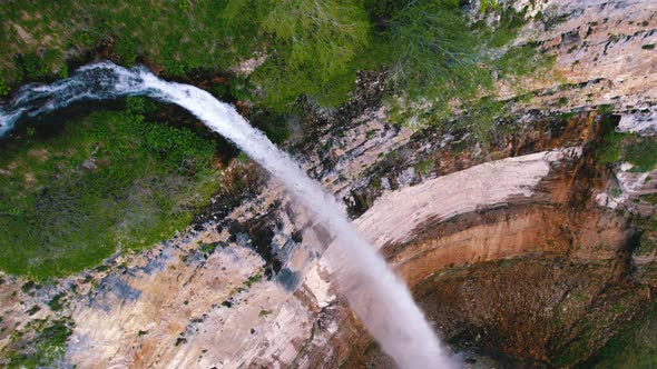 Ascending Shot of a Huge Marvelous Waterfall in Georgia Okatse Canyon alt