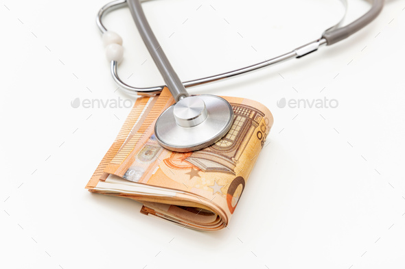 Healthcare cost. Medical stethoscope on Euro banknote stack isolated on white, close up