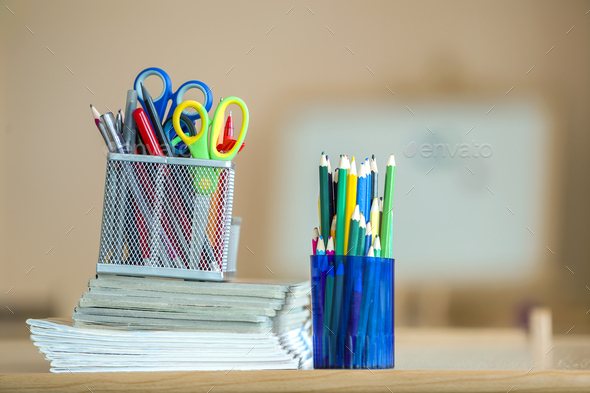 Premium Photo  School supplies on a desk stack of books notebook and many  pencils laying on the table