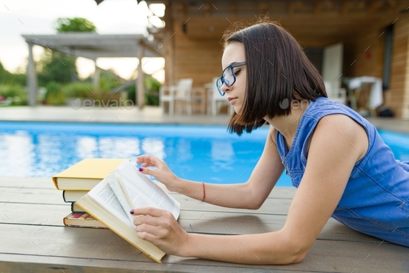 teen girl reading a book