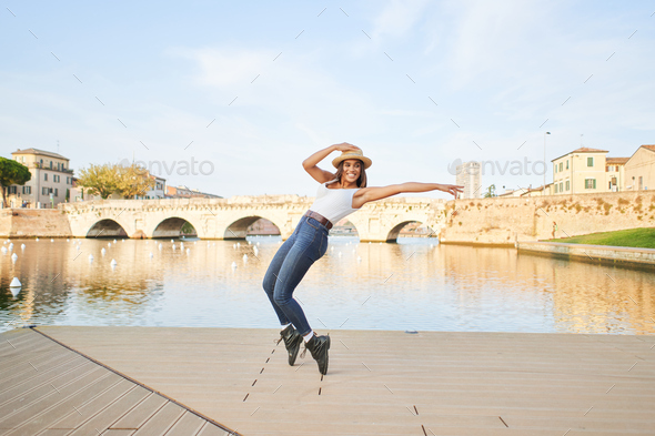 Happy woman having fun together. Young female dancer doing a dance step, multiracial tourist