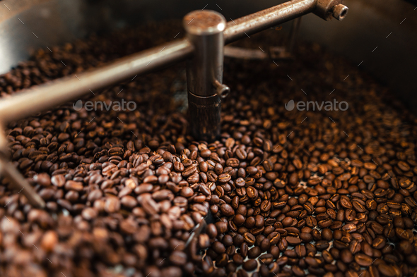 Roasted coffee beans in a cooling machine Stock Photo by ArtRachen