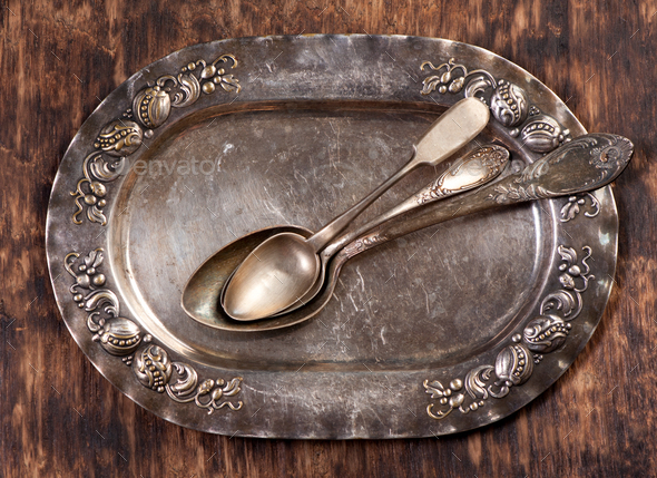 Vintage spoon on vintage plate. Vintage cutlery - Stock Photo - Images