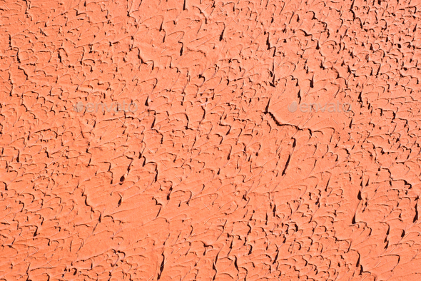 Decorative orange putty, plaster with imitation of a brush, drips to the side, textured background