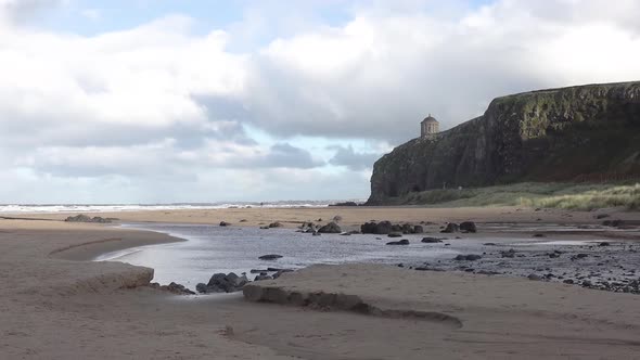 Timelapse of Downhill Beach with Rainbow and Train Passing at the Cliffs in County Londonderry in alt