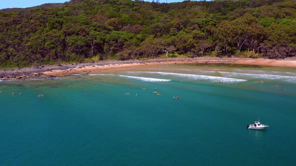 Surfers On The Calm Ocean Of Noosa Heads In Queensland, Australia. Aerial Shot alt