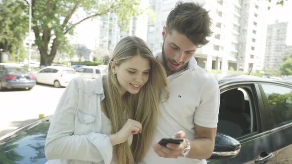 Young couple using smartphone