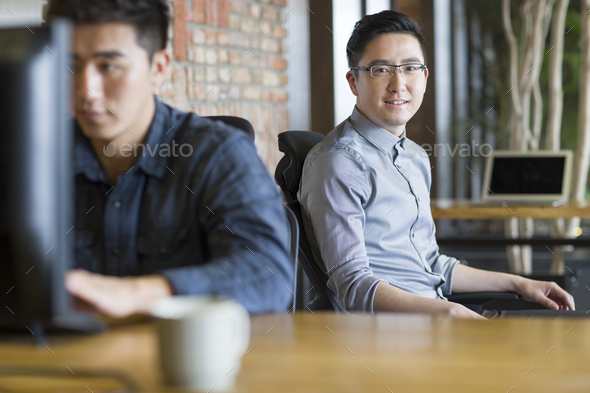IT workers sitting in office
