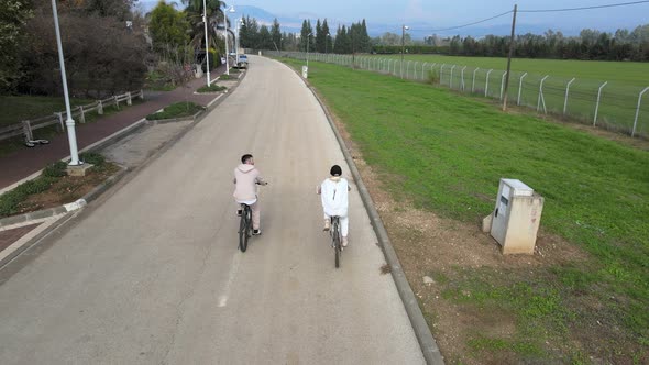 Couple in Love Enjoying a Bike Ride in the Countryside