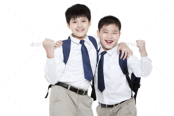 Intimate schoolboys punching the air happily