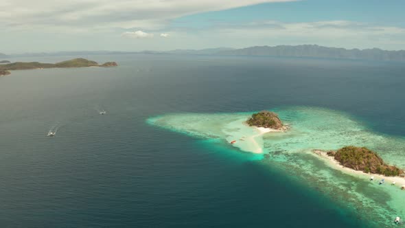 Small Torpic Island with a White Sandy Beach Top View alt