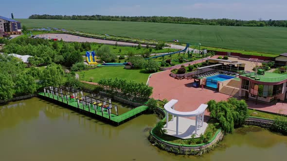 Modern recreation complex near the river. Park with relaxing area alt