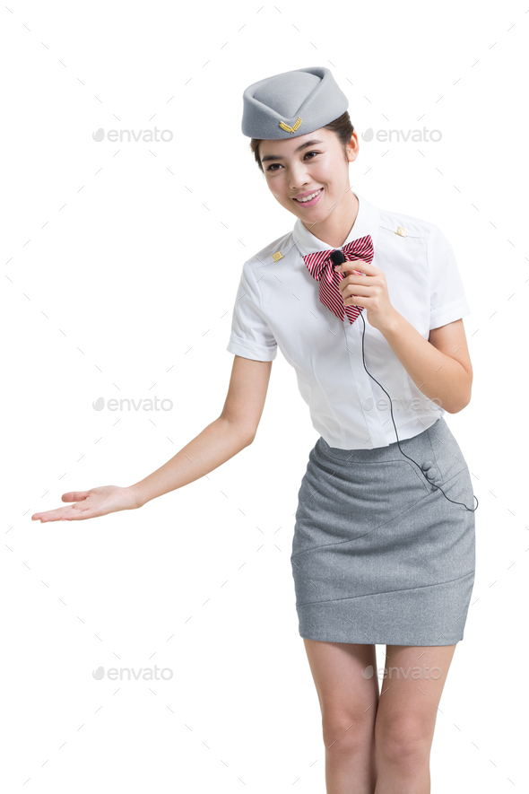 Smiling airline stewardess talking with microphone
