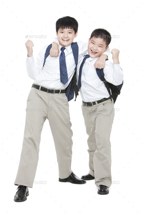 Excited schoolboys punching the air