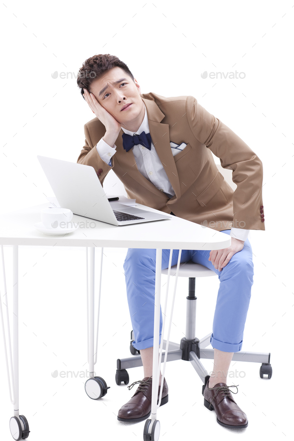 Fashionable young businessman in low spirits