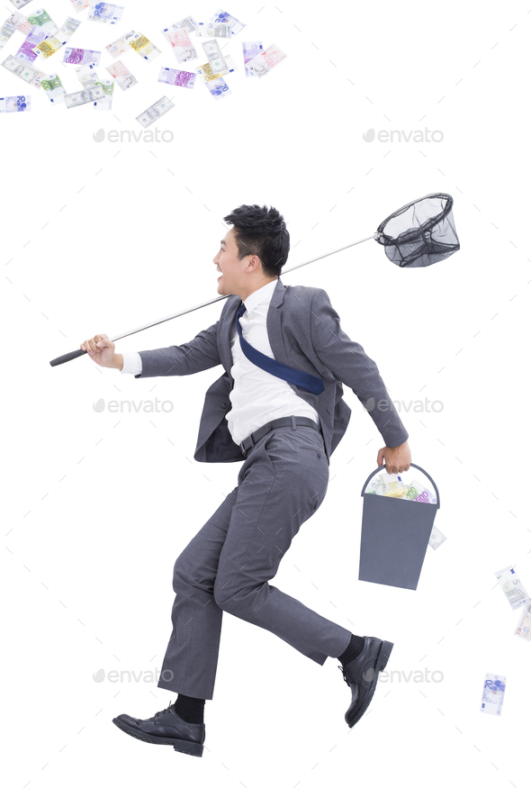 Businessman catching money with butterfly net