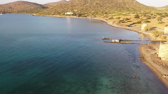 Aerial View of a Motor Boat in a Deep Blue Colored Sea. Kolokitha Island, Crete, Greece