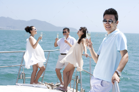 Friends Relaxing on a Yacht - Stock Photo - Images