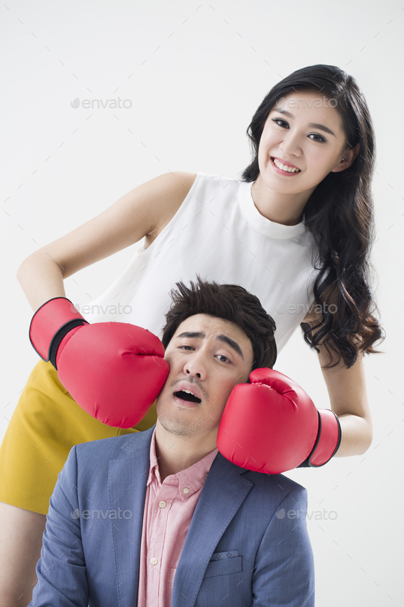 Humorous young Chinese couple - Stock Photo - Images