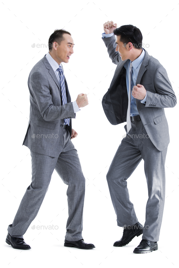Businessmen punching the air