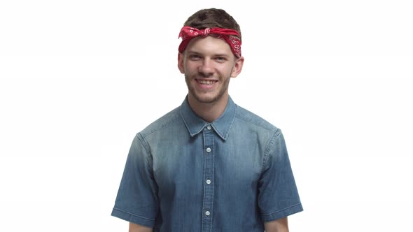 Video of Handsome Bearded Man with Red Headband Looking Happy and Satisfied Smiling at Camera