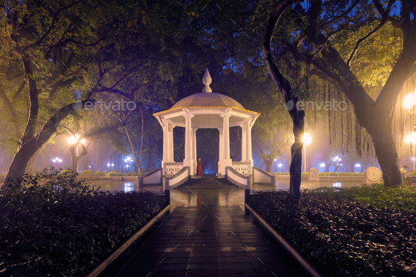Guangzhou People\'s Park with fog at night, China