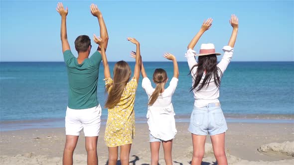 Young Family on Summer Beach Vacation
