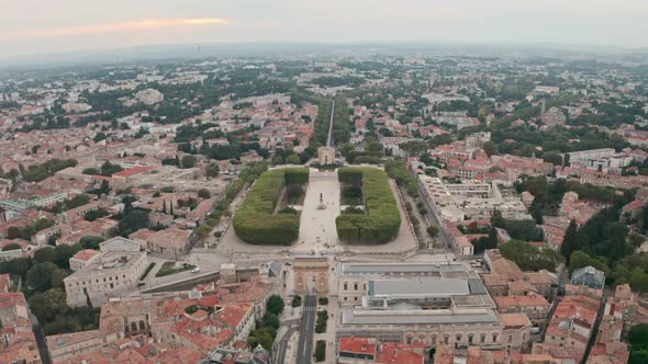 Dolly forward drone shot of Montpellier arc de triomphe alt