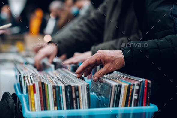 Man hands browsing vinyl album in a record store