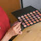 Close-up of woman holding makeup brush and blush and eyeshadow palette - PhotoDune Item for Sale