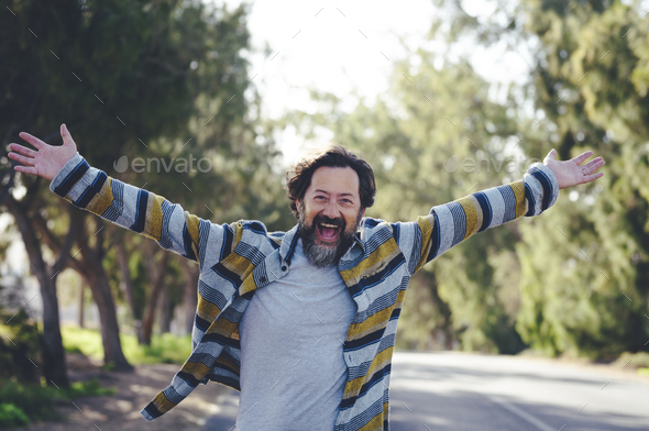 Crazy overjoyed adult man with arms outstretched smile and laugh alone in banner header