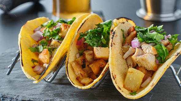 tasty grilled pineapple and chicken street tacos in metal tray