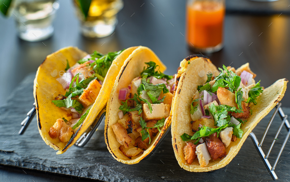 tasty grilled pineapple and chicken street tacos in metal tray