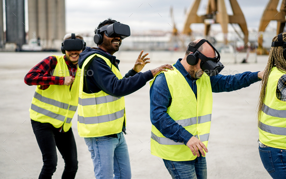 Multiracial workers dancing to music using virtual reality headsets at Freight Terminal Port - Stock Photo - Images