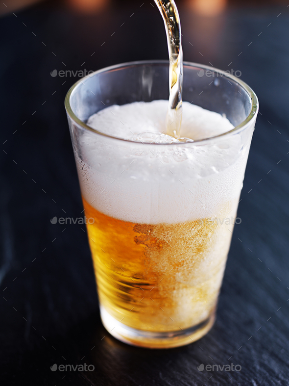 filling up a glass with beer