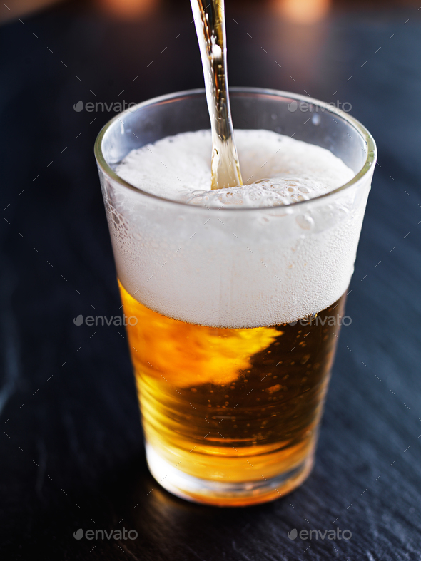 filling up a glass with beer