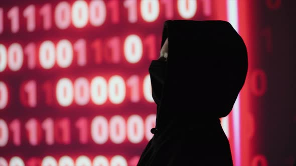 Hacker Anonymous No Face and Data on the Background alt