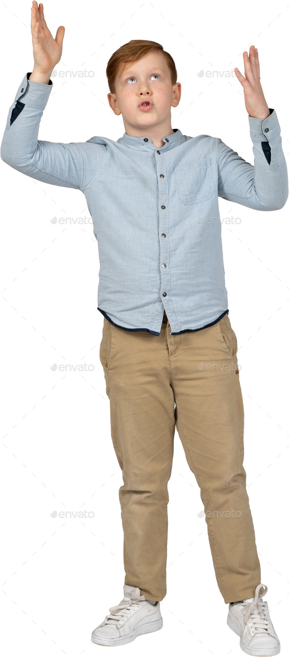 a young boy standing with his hands up in the air Stock Photo by Icons8