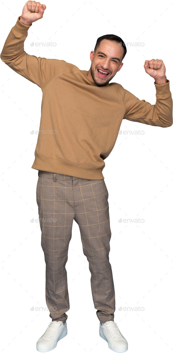 a man in a sweatshirt and pants with his arms in the air