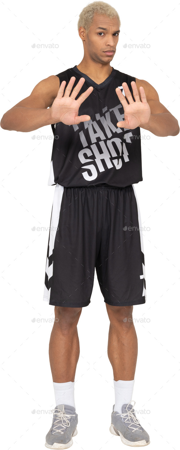 a man wearing basketball shorts and holding his hands out