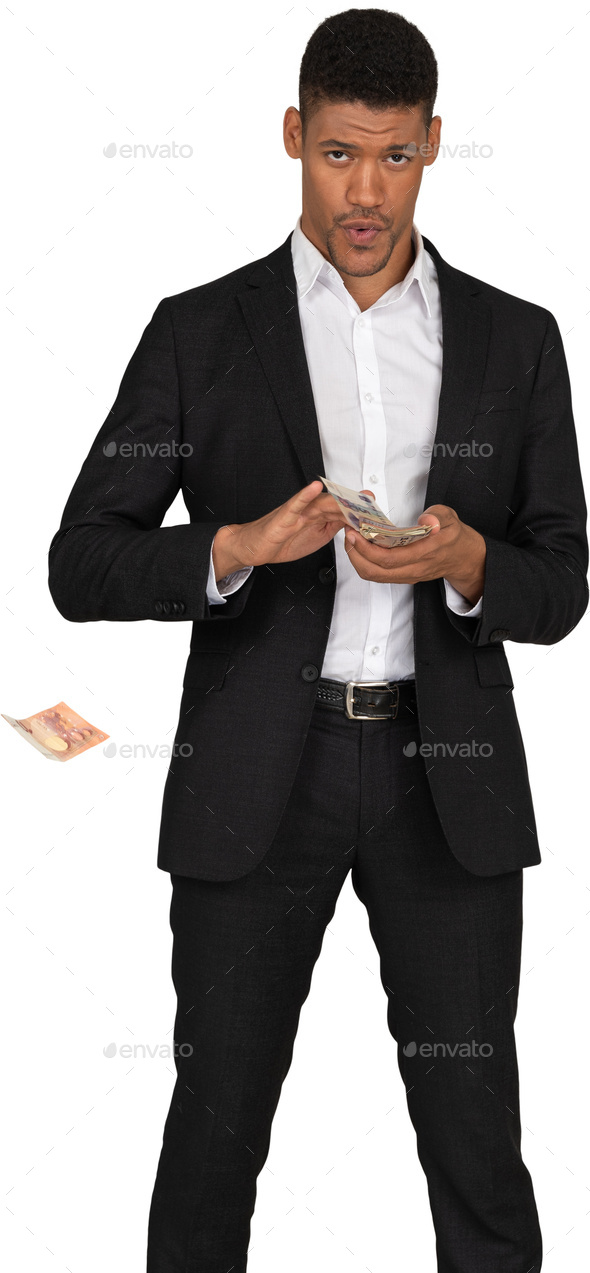 a man in a suit throwing money out of his hand