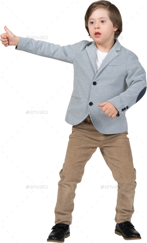 a young boy wearing a blue jacket and brown pants Stock Photo by Icons8