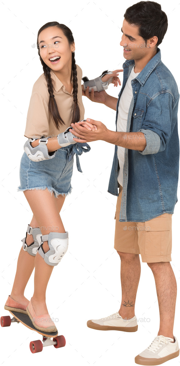 a man is standing on a skateboard and a woman is wearing knee pads