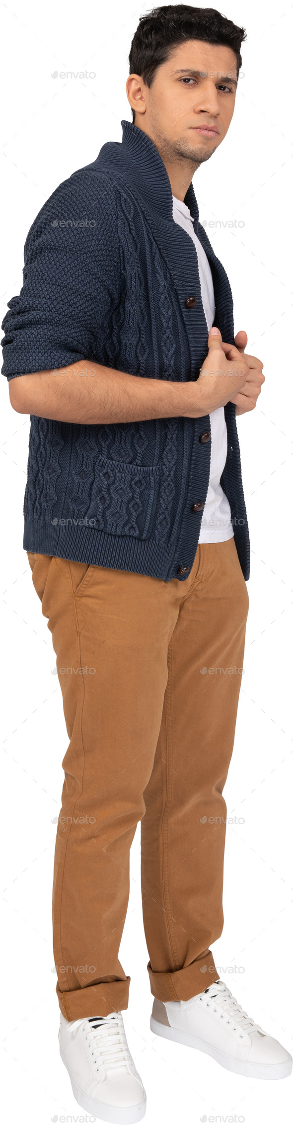 a man standing with his arms crossed and wearing a blue jacket and