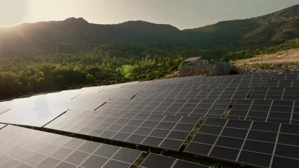 Solar panels on the background of green mountains. Alternative energy source alt