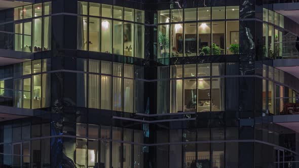 Flat Night Panorama of Multicolor Light in Windows of Multistory Buildings Aerial Timelapse alt