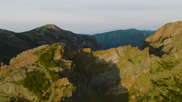 Dramatic craggy mountains of central Madeira, Pico do Areeiro trail; drone alt