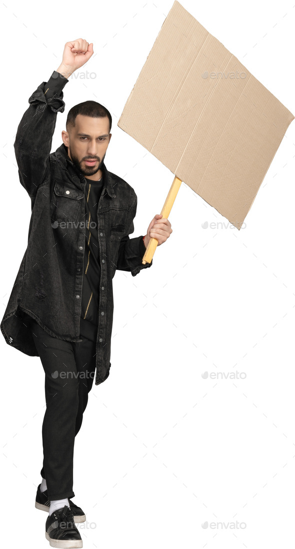 a man holding a protest sign with a fist in the air - Stock Photo - Images